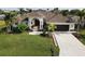 Single-Gathering home with a 2-car garage and lush landscaping at 15390 Ancel Cir, Port Charlotte, FL 33981