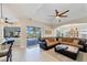 Comfortable Gathering room with large sectional sofa and pool access at 15390 Ancel Cir, Port Charlotte, FL 33981