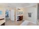 Large bathroom with corner vanity and tub at 15390 Ancel Cir, Port Charlotte, FL 33981