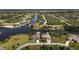 Aerial view of waterfront property with canal access at 15390 Ancel Cir, Port Charlotte, FL 33981
