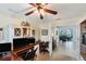 Spacious office with dual computer setup and view of piano at 15390 Ancel Cir, Port Charlotte, FL 33981