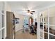 Home office with built-in shelving and french doors at 15390 Ancel Cir, Port Charlotte, FL 33981