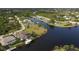 Wide aerial showcasing waterfront community and homes at 15390 Ancel Cir, Port Charlotte, FL 33981