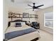 Cozy bedroom with a queen bed and built-in shelves at 15390 Ancel Cir, Port Charlotte, FL 33981