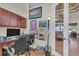 Bright home office with built-in desk and cabinets, offering a workspace with natural light at 9303 Migue Cir, Port Charlotte, FL 33981