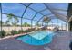 Inviting screened pool with ample deck space for lounging at 9303 Migue Cir, Port Charlotte, FL 33981