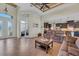 Spacious living room with tile floors, two sofas, and a view of the kitchen at 9303 Migue Cir, Port Charlotte, FL 33981