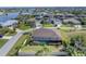 Aerial view of a home with private pool and fenced backyard in a quiet community at 9303 Migue Cir, Port Charlotte, FL 33981