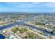 Aerial view of waterfront community, showcasing homes and canals at 9303 Migue Cir, Port Charlotte, FL 33981