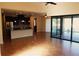 Open kitchen with island, stainless steel appliances, and access to backyard at 9303 Migue Cir, Port Charlotte, FL 33981