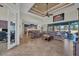 Open living area with tile floors, two sofas, and sliding glass doors leading to the backyard at 9303 Migue Cir, Port Charlotte, FL 33981