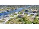 Aerial view of canal-front homes and neighborhood, showcasing waterfront living at 9303 Migue Cir, Port Charlotte, FL 33981