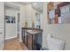 Well-appointed bathroom with granite countertop and dark wood cabinets at 9303 Migue Cir, Port Charlotte, FL 33981