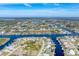 Wide aerial view of canal front homes and community at 9303 Migue Cir, Port Charlotte, FL 33981