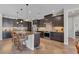 Kitchen features granite countertops, stainless steel appliances, and dark wood cabinetry at 9303 Migue Cir, Port Charlotte, FL 33981