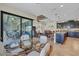 Bright breakfast nook with glass-top table and view of the kitchen and patio at 9303 Migue Cir, Port Charlotte, FL 33981