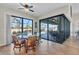 Breakfast nook with glass table and wicker chairs, overlooking the pool at 9303 Migue Cir, Port Charlotte, FL 33981