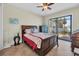 Bedroom with queen bed and access to the backyard at 9303 Migue Cir, Port Charlotte, FL 33981