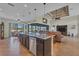 Open kitchen with granite island, stainless steel appliances, and views to the Gathering room at 9303 Migue Cir, Port Charlotte, FL 33981