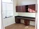 Bright home office features built-in cabinetry and granite countertops at 9303 Migue Cir, Port Charlotte, FL 33981