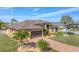 One-story house with two-car garage and palm trees at 9303 Migue Cir, Port Charlotte, FL 33981