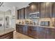 Kitchen with built-in coffee bar and ample cabinetry at 9303 Migue Cir, Port Charlotte, FL 33981