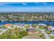 Aerial view of a waterfront community featuring luxury homes and tranquil canals at 9303 Migue Cir, Port Charlotte, FL 33981