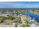Canal-front community with various house styles and lush landscaping at 9303 Migue Cir, Port Charlotte, FL 33981