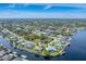 Aerial view showcasing waterfront homes and tranquil waterways at 9303 Migue Cir, Port Charlotte, FL 33981