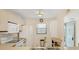 Bright kitchen featuring white appliances, and ample counter space, with window and light fixture at 175 Kings Hwy # 1014, Punta Gorda, FL 33983