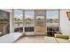 Enclosed lanai features serene lake views, tile floors, and comfortable seating at 175 Kings Hwy # 1014, Punta Gorda, FL 33983