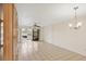 Spacious living room with tile flooring and sliding glass doors to the lanai at 175 Kings Hwy # 1014, Punta Gorda, FL 33983