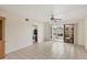Large living room with a ceiling fan and access to the outdoor balcony at 175 Kings Hwy # 1014, Punta Gorda, FL 33983