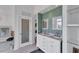 Elegant bathroom with double vanity and a tiled shower at 3 Pointe Way, Placida, FL 33946