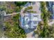 Bird's eye view of a waterfront home showcasing the metal roof and layout at 3 Pointe Way, Placida, FL 33946