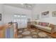 Bright living room with high ceilings and hardwood floors at 13044 Via Cassia, Placida, FL 33946
