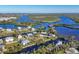 Aerial view of upscale waterfront community with lush landscaping at 13044 Via Cassia, Placida, FL 33946