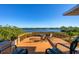 Serene waterfront deck with seating for relaxing at 13044 Via Cassia, Placida, FL 33946