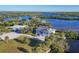 Waterfront home with circular driveway and boat at 13044 Via Cassia, Placida, FL 33946