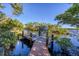 Private wooden boat dock with lift and walkway at 13044 Via Cassia, Placida, FL 33946