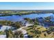 Expansive aerial view showcasing a waterfront property and neighborhood at 13044 Via Cassia, Placida, FL 33946