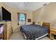 Guest bedroom with king-size bed and large flat screen TV at 13044 Via Cassia, Placida, FL 33946