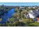 Waterfront property with boat and lush landscaping at 13044 Via Cassia, Placida, FL 33946