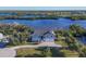 Stunning waterfront home with large yard and golf course view at 13044 Via Cassia, Placida, FL 33946