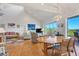 Open dining area with a large table and access to deck at 13044 Via Cassia, Placida, FL 33946