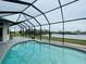 Enjoy the lake view from this screened pool area at 8 Sportsman Ter, Rotonda West, FL 33947