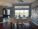 Spacious dining room with large windows and lake view at 8 Sportsman Ter, Rotonda West, FL 33947