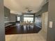 Bright dining room with dark wood floors and lake view at 8 Sportsman Ter, Rotonda West, FL 33947
