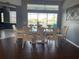 Bright dining room with large windows and a spacious table, perfect for Gathering gatherings at 8 Sportsman Ter, Rotonda West, FL 33947
