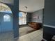 Light and airy entryway with a blue door and a comfortable couch at 8 Sportsman Ter, Rotonda West, FL 33947